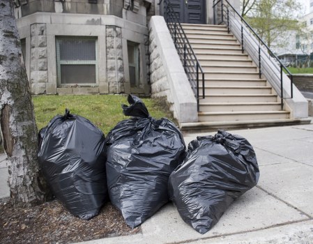 Office clearance process with packaged items being moved out
